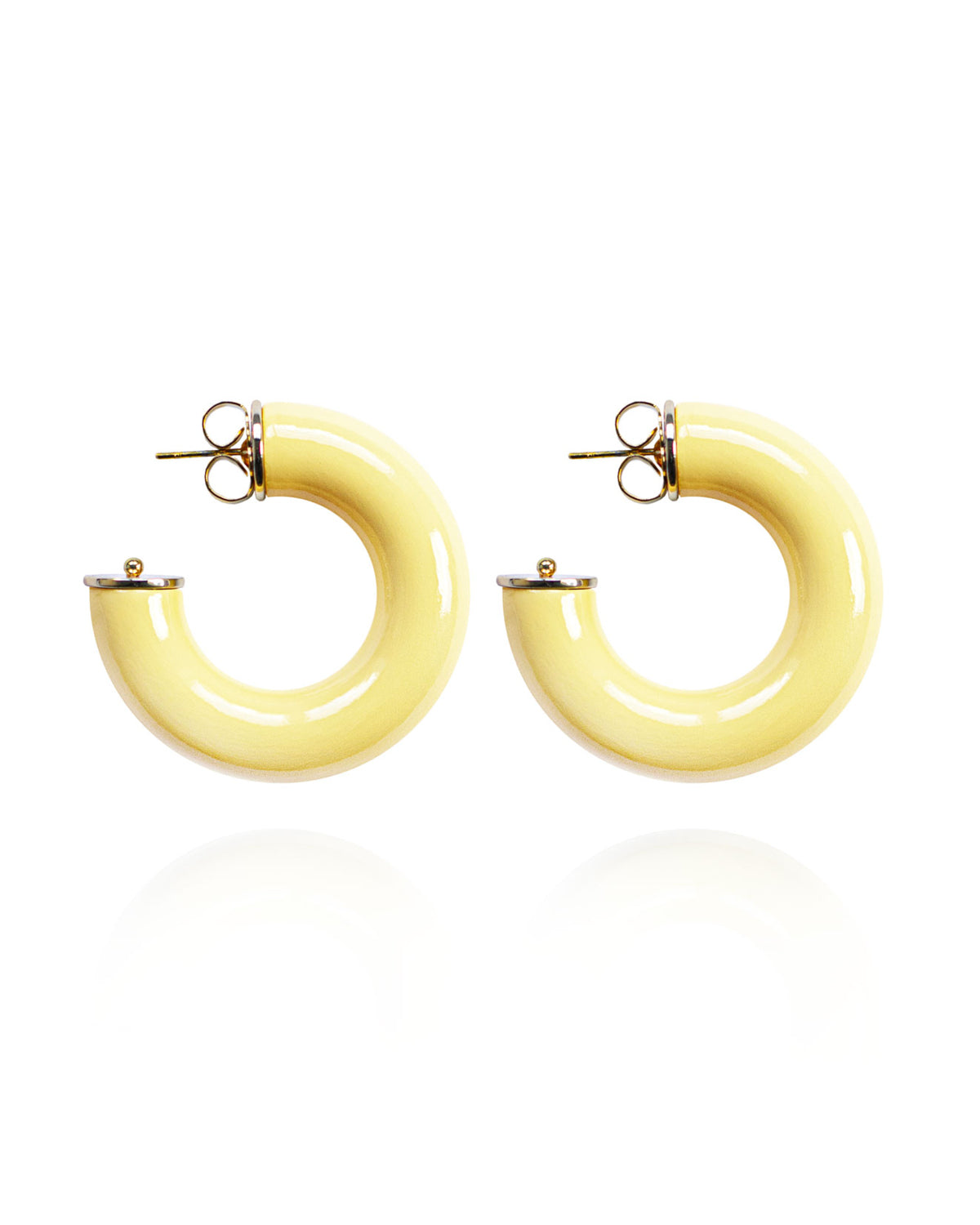 Pair of yellow hoop earrings on a white background