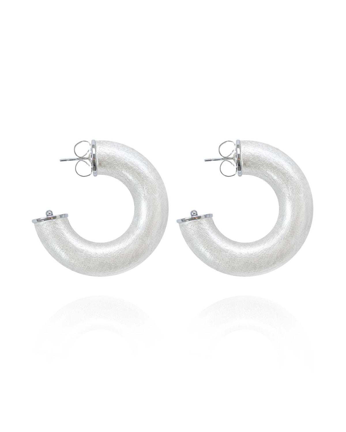 Pair of silver hoop earrings on a white background