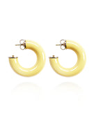 Pair of yellow hoop earrings on a white background